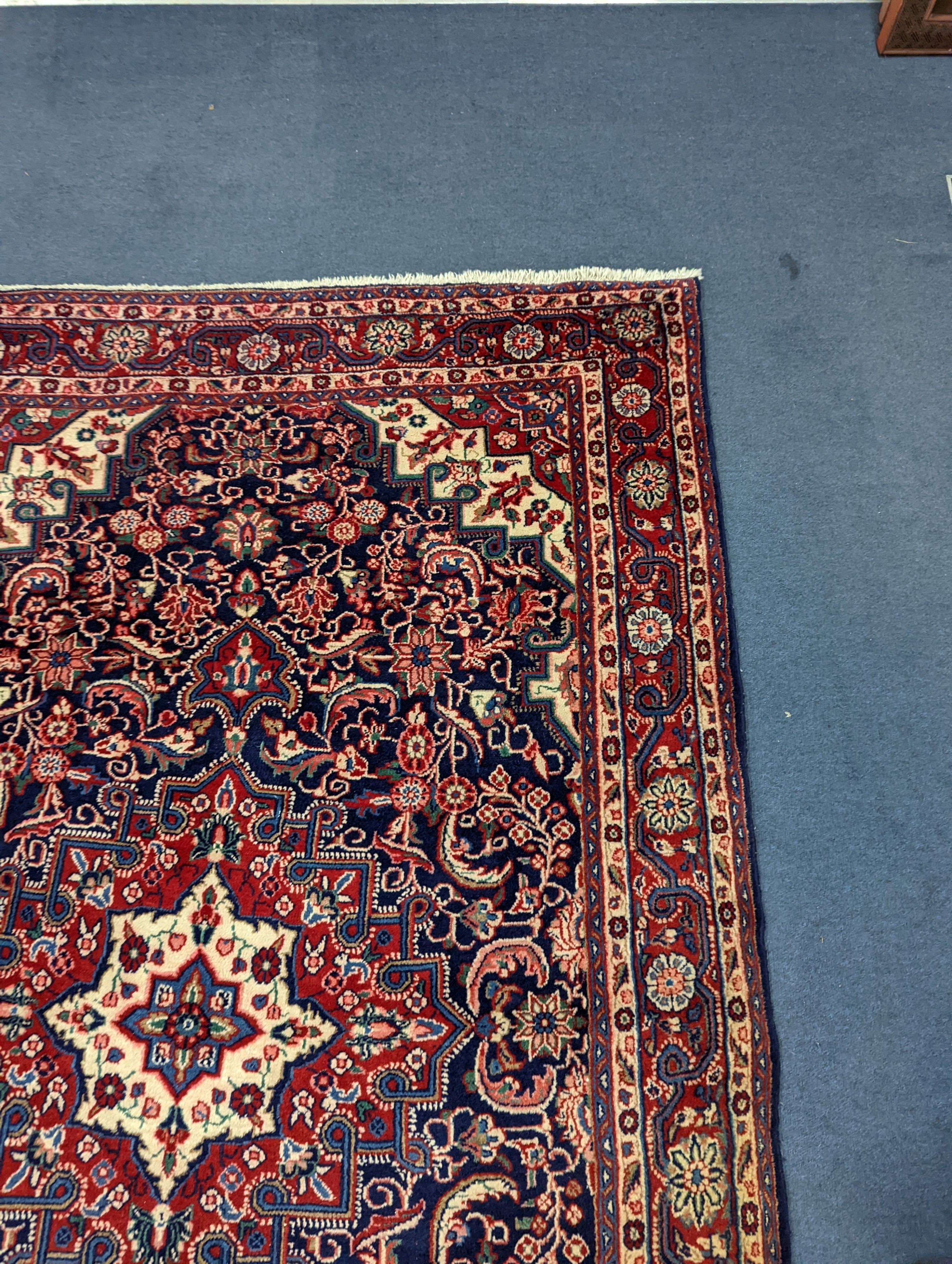 A North West Persian blue ground rug, 210 x 130cm